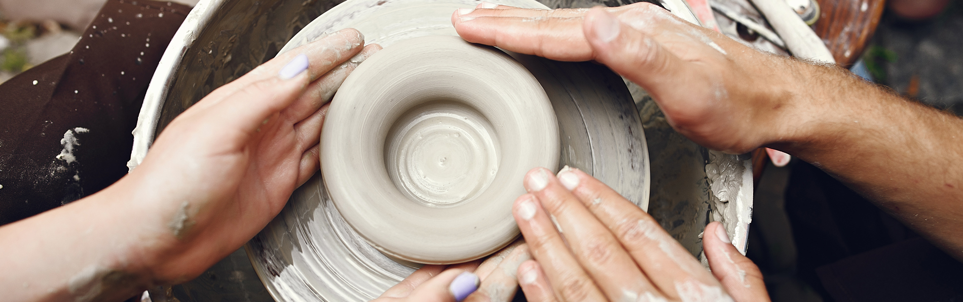 hands-doing-pottery-close-up
