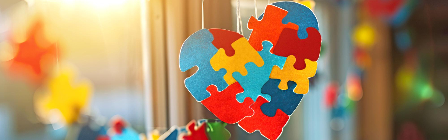 window-is-decorated-with-colorful-puzzles-bright-hearts-world-autism-day
